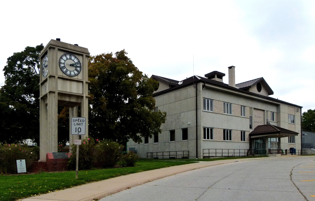 Clock tower and municipal-style building in Glenwood, Iowa.