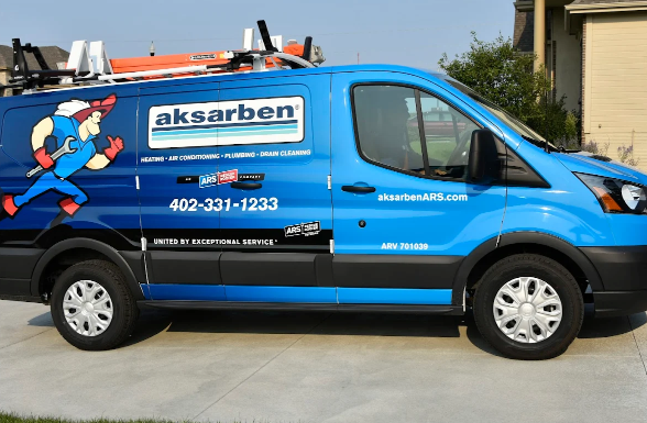 An Aksarben van parked in a driveway